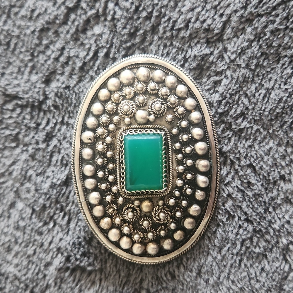 Green stone brooch